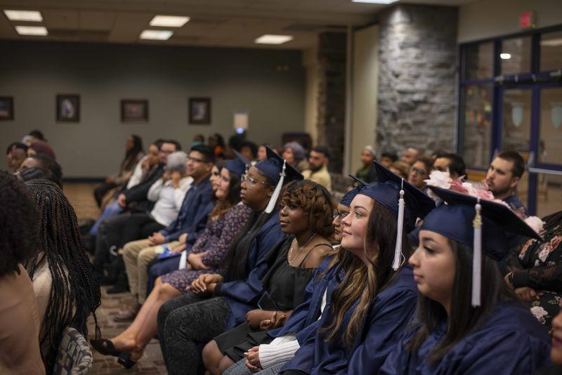 students sitting at ceremony